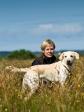 <a href="/ajaxhund.php?hund=Ravensbank%20Sun" data-toggle="modal" data-target="#myModal" data-remote="false" >Ravensbank Sun (Sun)</a> and Ms. Ann Schmidt in August 2012, where Sun is 15 months old. <span id="copyright">&copy;Jan Jørgensen</span>